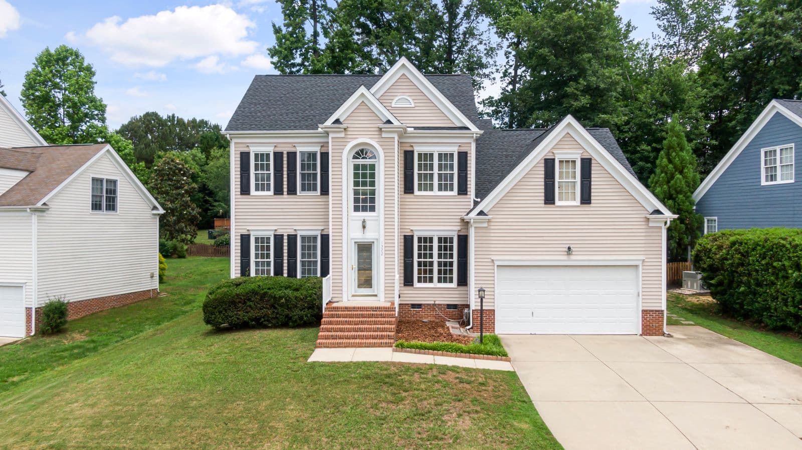 Well-kept home exterior with new driveway